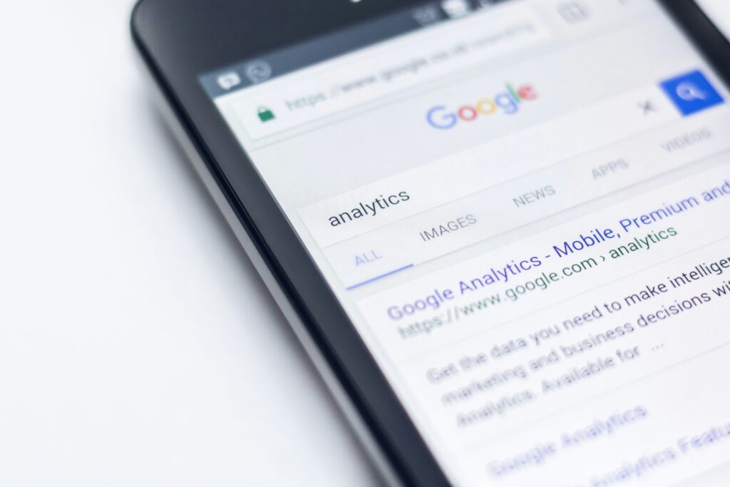 Smartphone displaying Google search results for digital marketing strategies