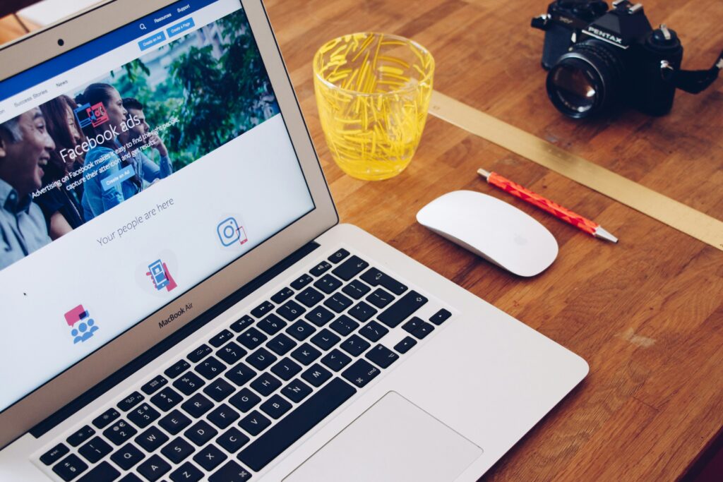 Laptop showing Facebook Ads dashboard with marketing charts – representing digital advertising setup